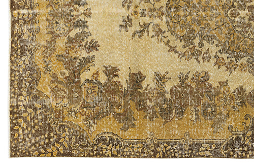 Load image 1 in gallery view. Gold and brown vintage-style rug with a distressed floral medallion pattern and a detailed border.