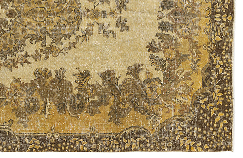 Load image 1 in gallery view. Distressed mustard yellow and dark brown rug with a traditional floral medallion pattern on a cream background.