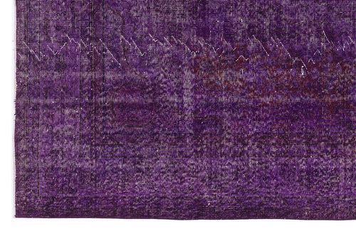 Load image 1 in gallery view. Deep purple vintage-style rug with a distressed, faded traditional medallion pattern and a geometric border.
