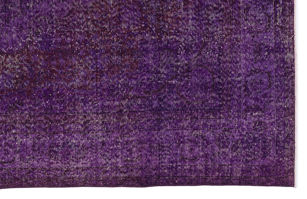 Deep purple vintage-style rug with a distressed, faded traditional medallion pattern.