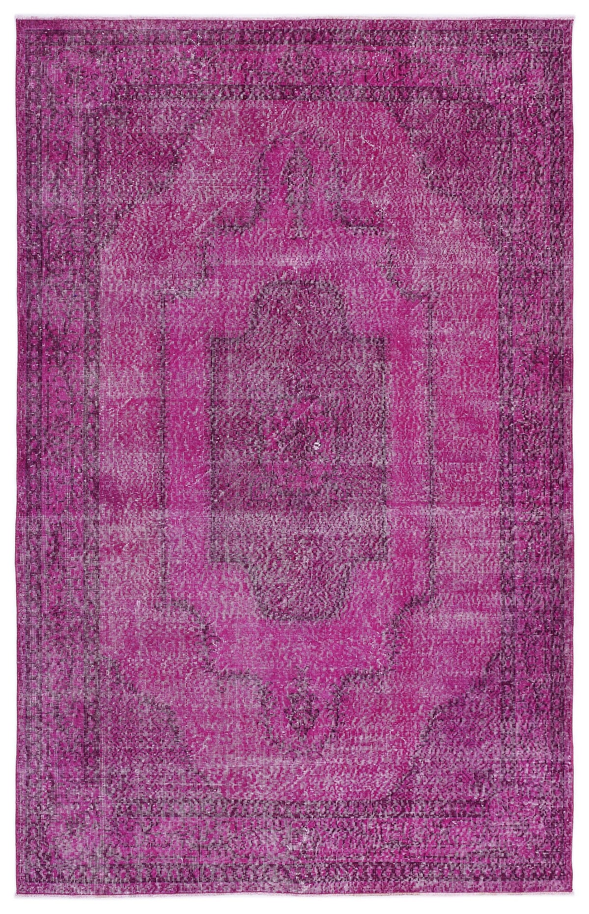 Magenta distressed vintage-style rug with a central medallion and ornate border pattern.