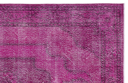 Load image 1 in gallery view. Magenta and dark purple distressed vintage-style rug with a traditional border and faded medallion pattern.
