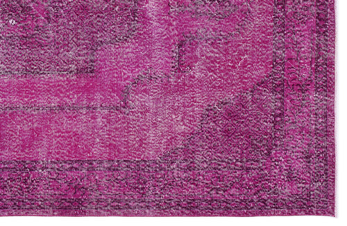 Load image 1 in gallery view. Magenta and dark purple distressed vintage-style rug with a traditional ornate border and faded medallion pattern.