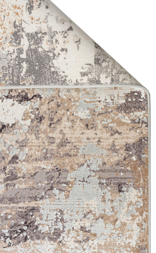 Bild 1 in Galerieansicht laden. Beige, grey, and white abstract distressed rug with a folded corner showing the backing on a white background.