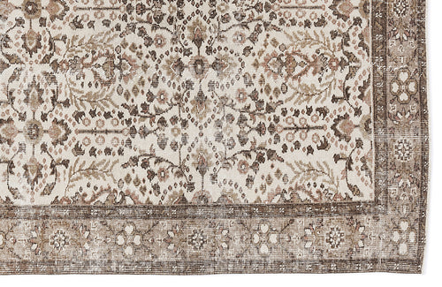 Load image 1 in gallery view. Cream, brown, and muted pink traditional rug with a distressed floral medallion pattern and a wide decorative border.