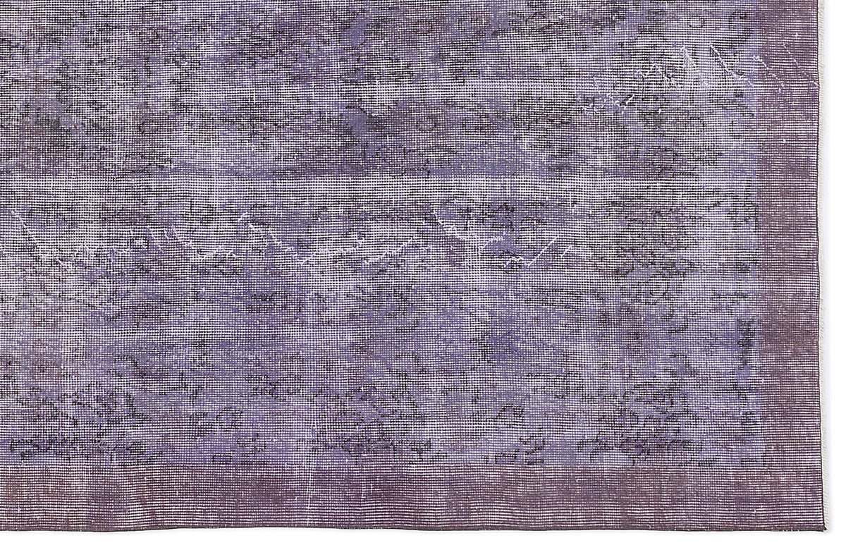 Deep purple distressed rug with a faded, overdyed vintage pattern and a solid border.