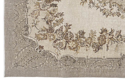 Load image 1 in gallery view. Beige and taupe vintage-style rug with a distressed floral medallion pattern and ornate border.