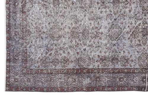 Load image 1 in gallery view. Distressed grey and burgundy rug with a traditional floral medallion pattern and a wide decorative border.