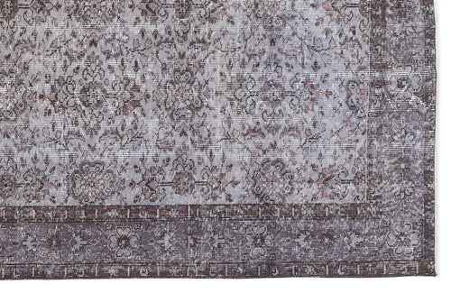 Load image 1 in gallery view. Distressed grey and charcoal rug with a traditional floral medallion pattern and a wide, ornate border.