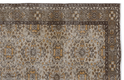 Load image 1 in gallery view. Brown, grey, and ochre traditional rug with a distressed floral medallion pattern and a detailed geometric border.