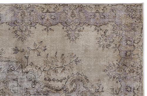 Load image 1 in gallery view. Distressed beige and lavender rug with a faded traditional floral medallion pattern.