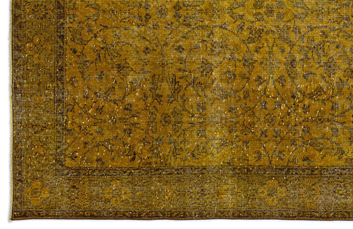 Load image 1 in gallery view. Mustard yellow distressed rug with a traditional floral medallion pattern and a bordered edge.