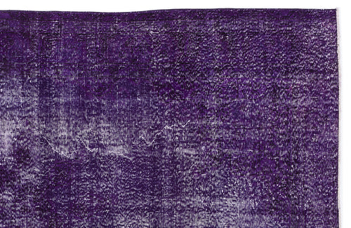 Load image 1 in gallery view. Deep purple vintage-style rug with a distressed, faded texture and white highlights.