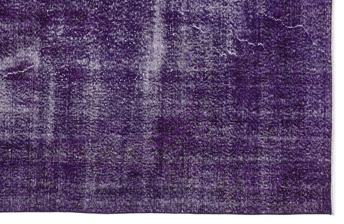 Load image 1 in gallery view. Deep purple rug with a distressed, weathered texture and white faded detailing.