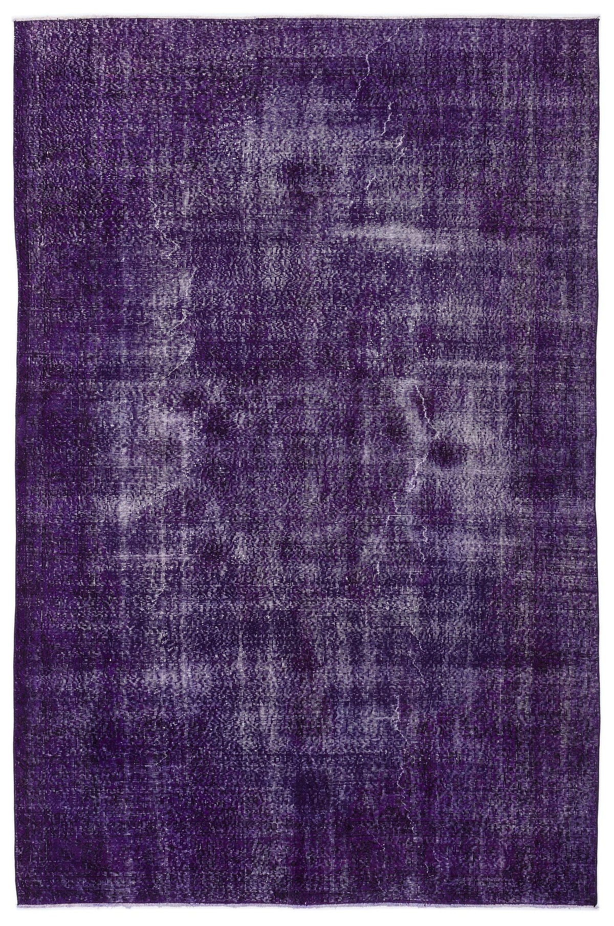 Deep purple distressed overdyed rug with a faded, textured finish on a white background.