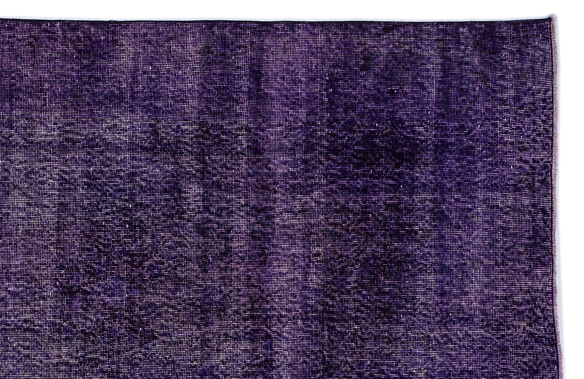 Deep purple vintage-style rug with a distressed, faded texture on a white background.