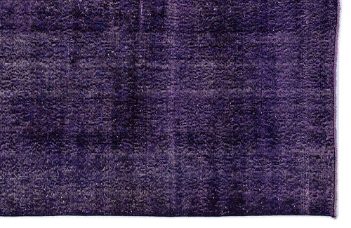 Load image 1 in gallery view. Deep purple distressed rug with a textured, monochromatic weave and frayed edge.