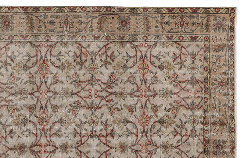 Load image 1 in gallery view. Beige and taupe traditional rug with a repeating floral vine pattern in red and brown, featuring a decorative border.