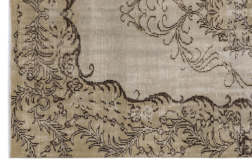 Load image 1 in gallery view. Taupe and dark brown distressed rug with an ornate, traditional floral medallion pattern.