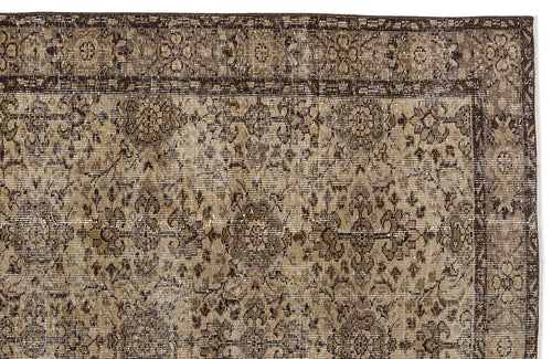 Load image 1 in gallery view. Dark brown and beige vintage-style rug with a distressed floral medallion pattern and a decorative border.