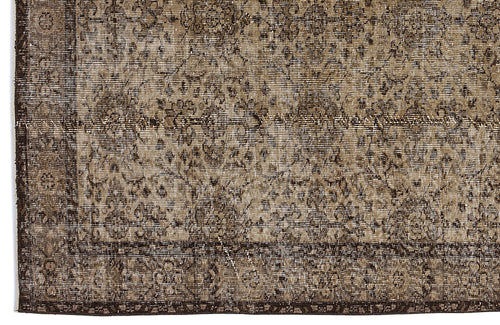 Load image 1 in gallery view. Dark brown and beige vintage-style rug with a distressed floral medallion pattern and a detailed border.