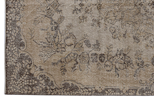 Load image 1 in gallery view. Taupe and dark brown vintage-style rug with a distressed floral medallion pattern.