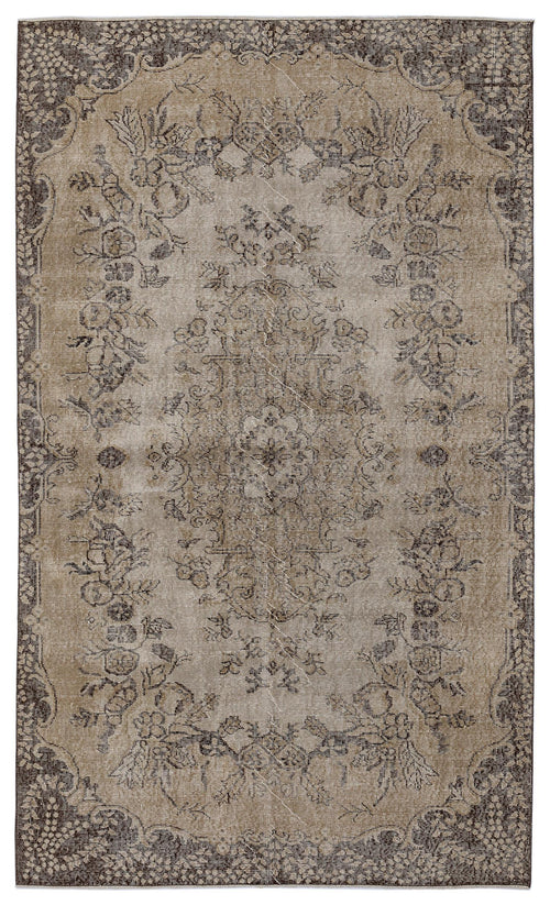 Load image 1 in gallery view. Distressed brown and beige vintage-style rug with a central floral medallion and ornate border pattern.
