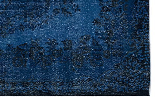 Load image 1 in gallery view. Deep blue and black distressed rug with a traditional floral medallion pattern.