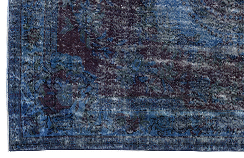 Load image 1 in gallery view. Deep blue and dark purple distressed rug with a traditional ornate floral medallion pattern.