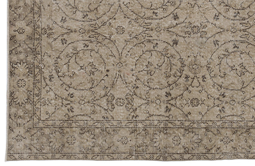 Load image 1 in gallery view. Taupe and brown vintage-style rug with a distressed floral medallion pattern and a decorative border.