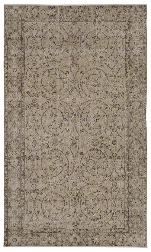 Load image 1 in gallery view. Taupe and charcoal distressed rug with a traditional circular floral medallion pattern and a decorative border.