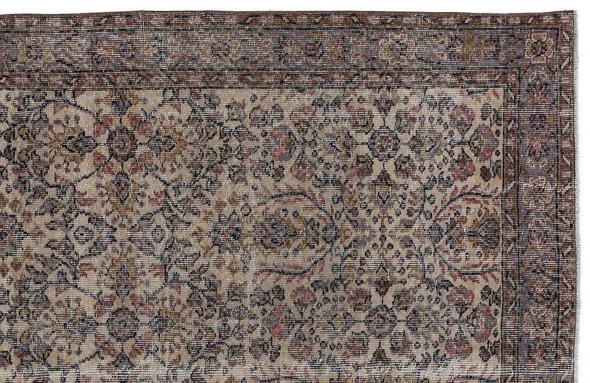 Beige traditional rug with a distressed floral medallion pattern and a dark brown border on a white background.