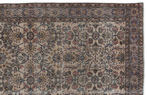 Load image 1 in gallery view. Beige traditional rug with a distressed floral medallion pattern and a dark brown border on a white background.