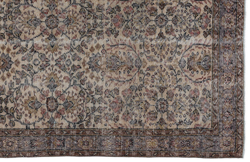 Load image 1 in gallery view. Distressed beige, brown, and muted red rug with a traditional floral medallion pattern and a wide decorative border.
