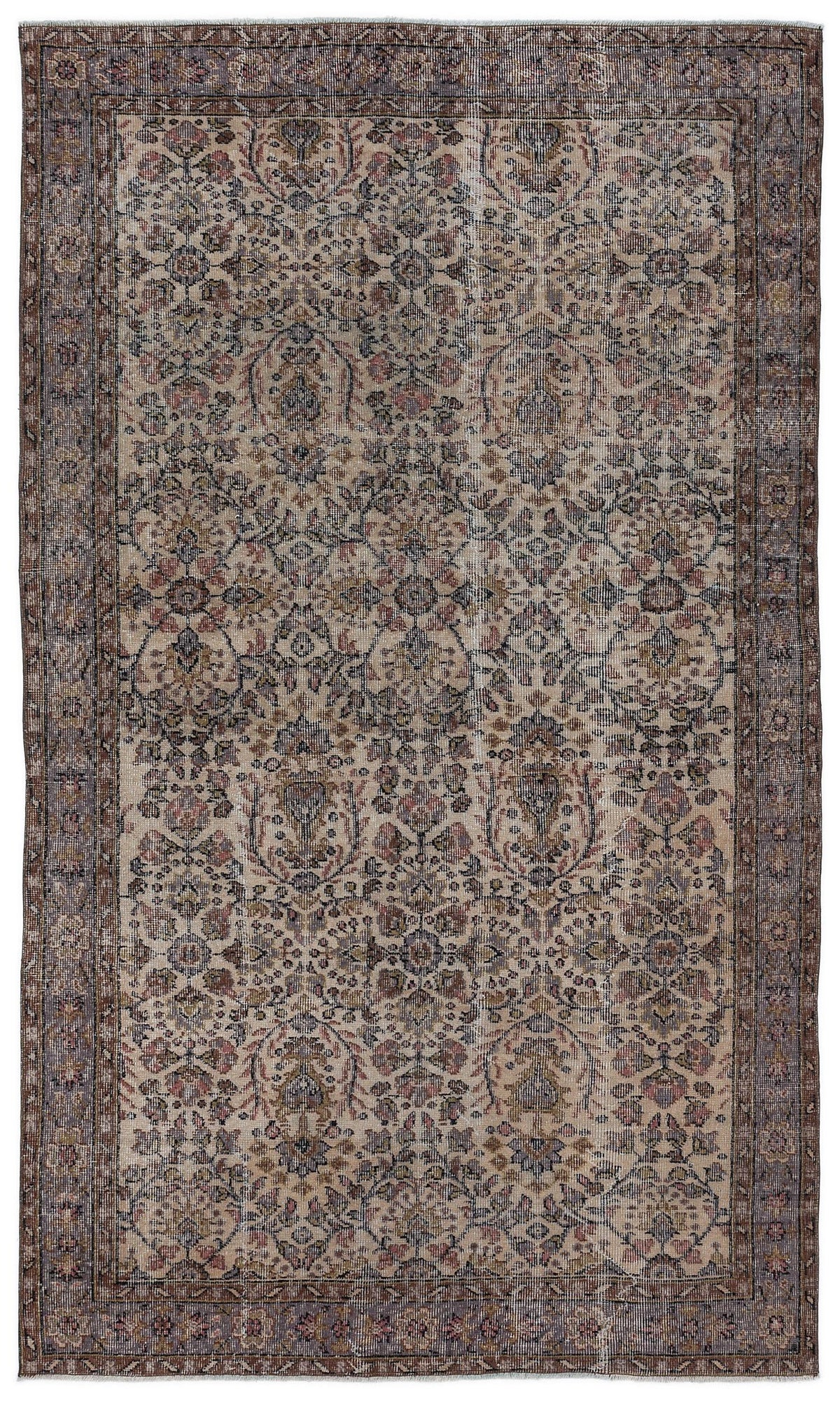 Distressed beige rug with a faded floral medallion pattern in muted tones of blue, brown, and rose.