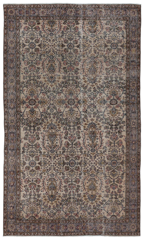 Load image 1 in gallery view. Distressed beige rug with a faded floral medallion pattern in muted tones of blue, brown, and rose.