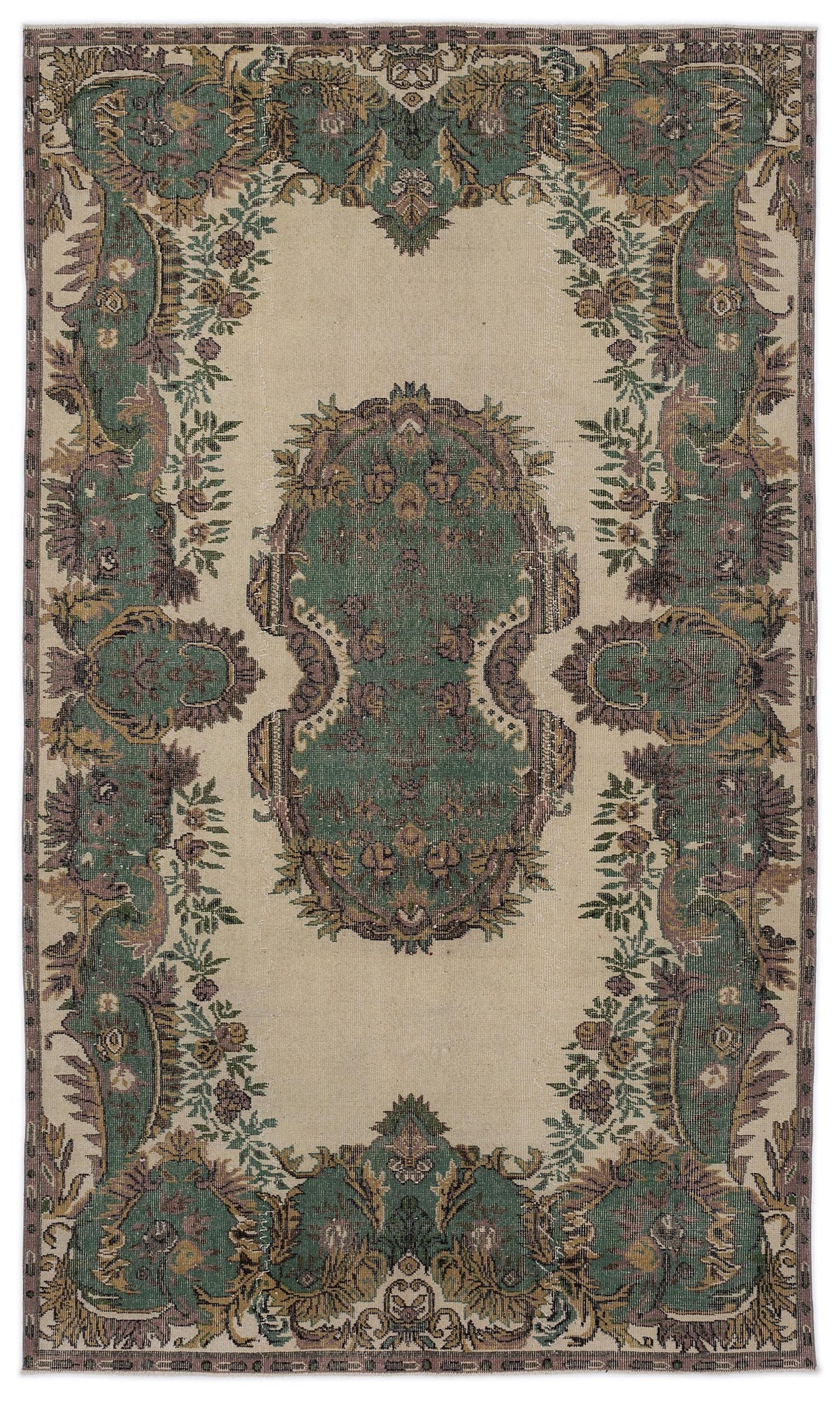 Beige rug with a central green floral medallion and ornate botanical border in shades of green, brown, and muted purple.