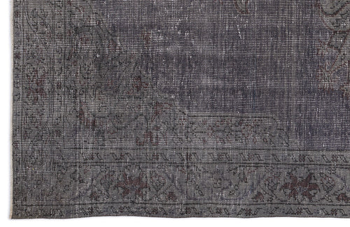 Load image 1 in gallery view. Charcoal and dark grey distressed rug with a faded traditional medallion pattern and a detailed geometric border.