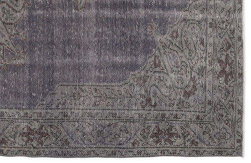Load image 1 in gallery view. Charcoal and grey distressed rug with a faded traditional floral border and medallion corner detail.