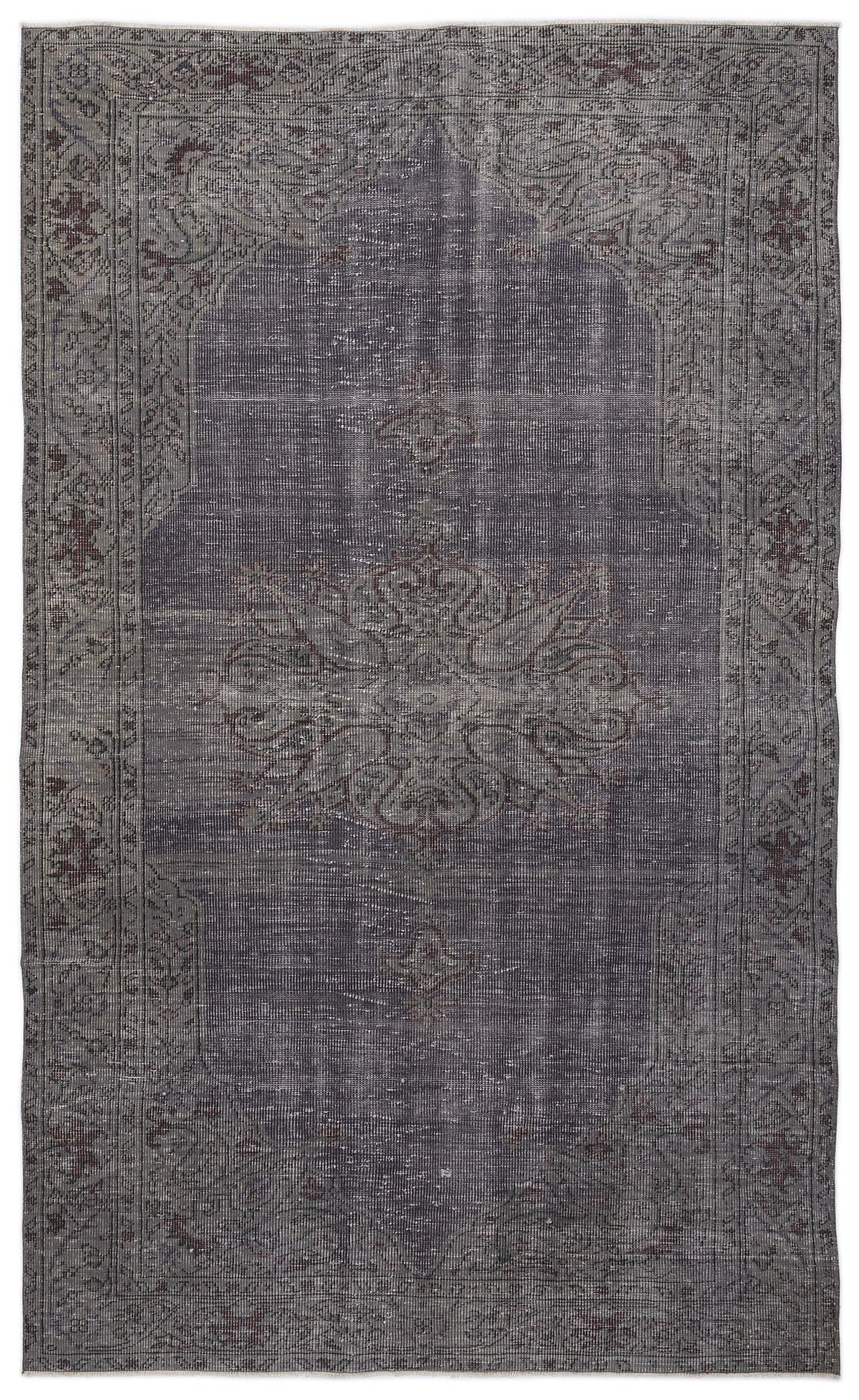 Charcoal and dark grey distressed rug with a central floral medallion and ornate border pattern.