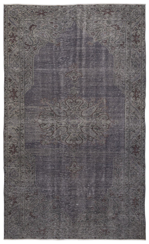 Load image 1 in gallery view. Charcoal and dark grey distressed rug with a central floral medallion and ornate border pattern.