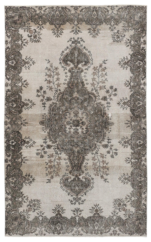 Load image 1 in gallery view. Distressed beige and charcoal grey rug featuring a traditional central medallion and ornate floral border.