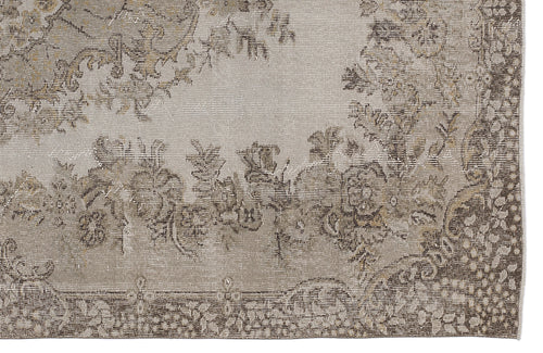 Load image 1 in gallery view. Beige and taupe distressed rug with a faded floral medallion pattern and a detailed botanical border.