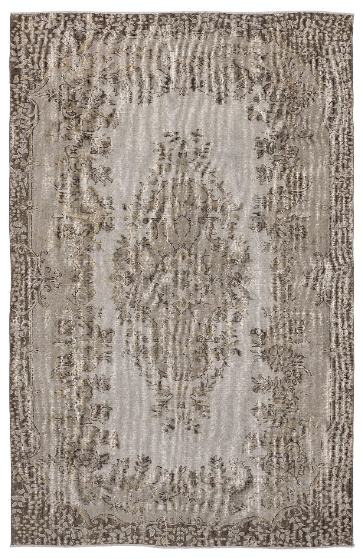 Taupe and beige vintage-style rug with a distressed floral medallion pattern and a decorative border.