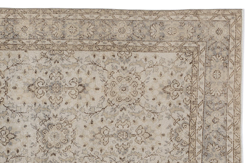 Load image 1 in gallery view. Beige and grey traditional rug with a distressed floral medallion pattern and a geometric border.
