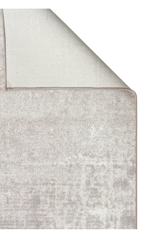 Load image 1 in gallery view. Light grey and white distressed area rug with a folded corner showing the woven backing and finished edge.