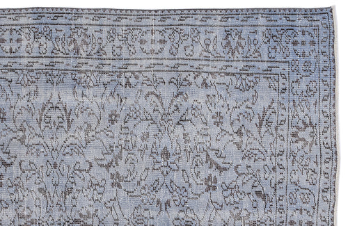 Load image 1 in gallery view. Light blue and charcoal grey rug with a distressed traditional floral medallion pattern and a detailed border.