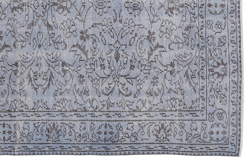 Load image 1 in gallery view. Light blue and charcoal grey rug with a traditional floral medallion pattern and a detailed geometric border.