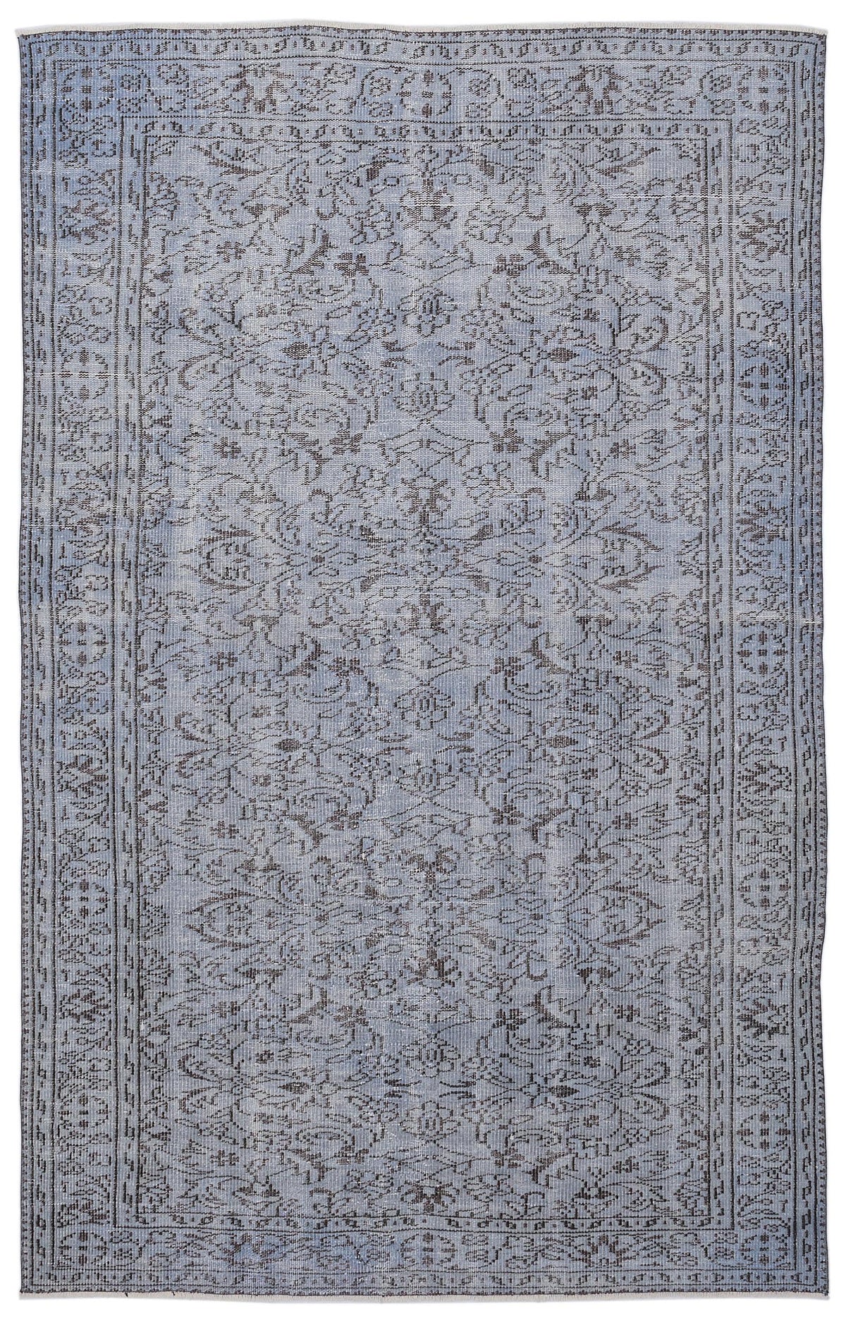 Light blue and charcoal grey vintage-style rug with a distressed floral medallion pattern and a detailed border.