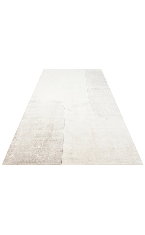 Load image 1 in gallery view. Off-white and light beige area rug with a minimalist abstract curved block pattern on a white background.